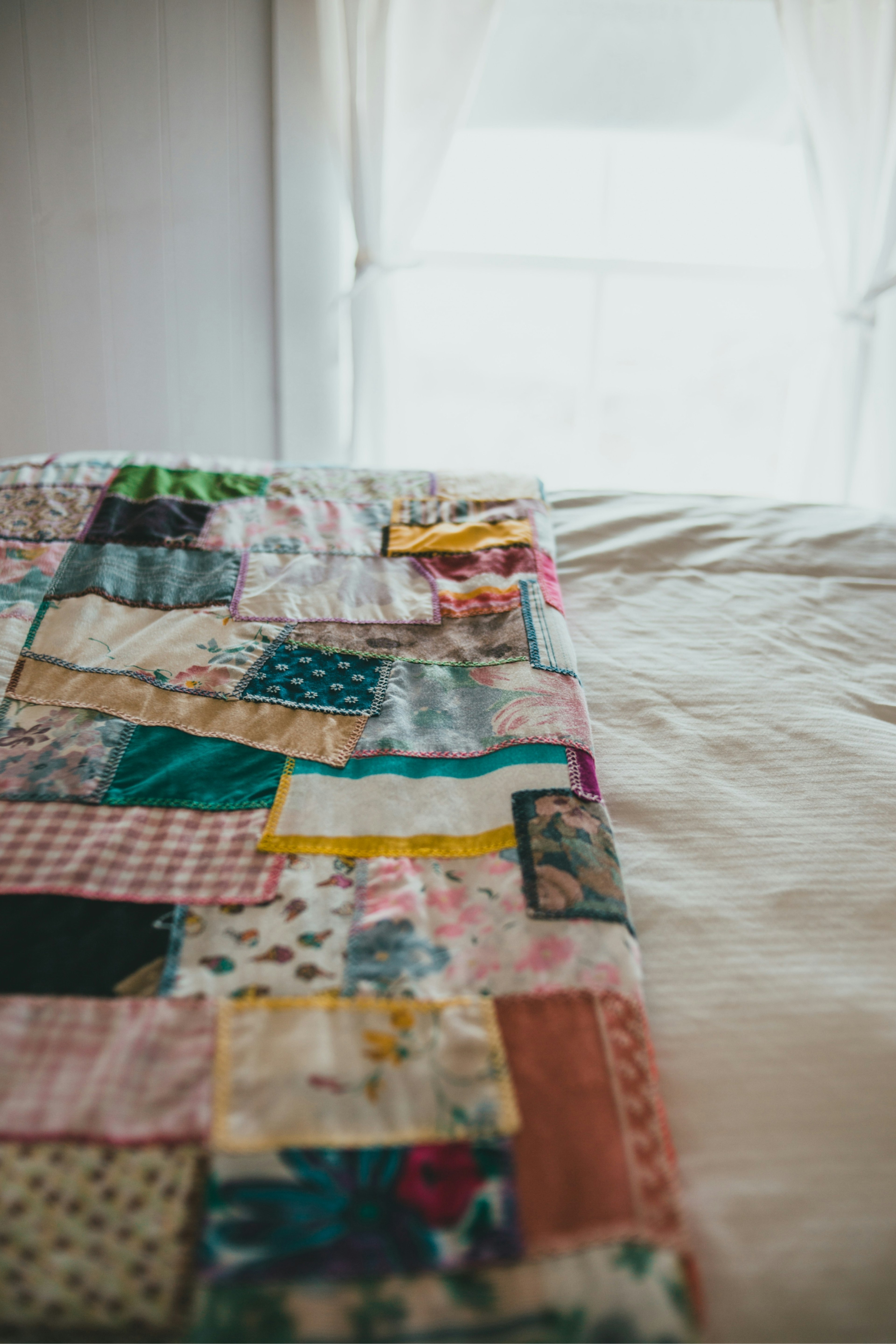 A quilt on a bed