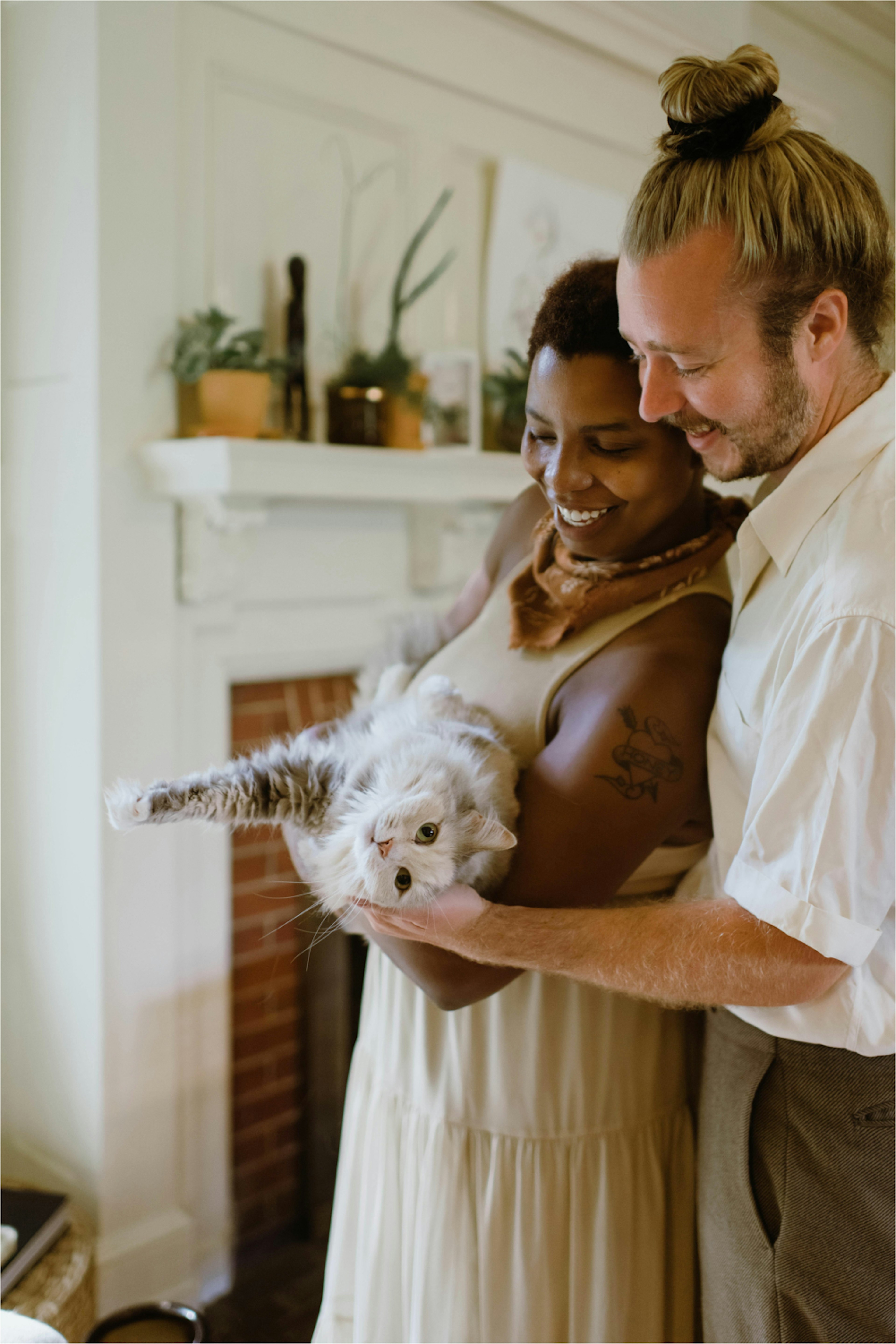 Be a Voice Client Advocacy: Couple holding happy cat.