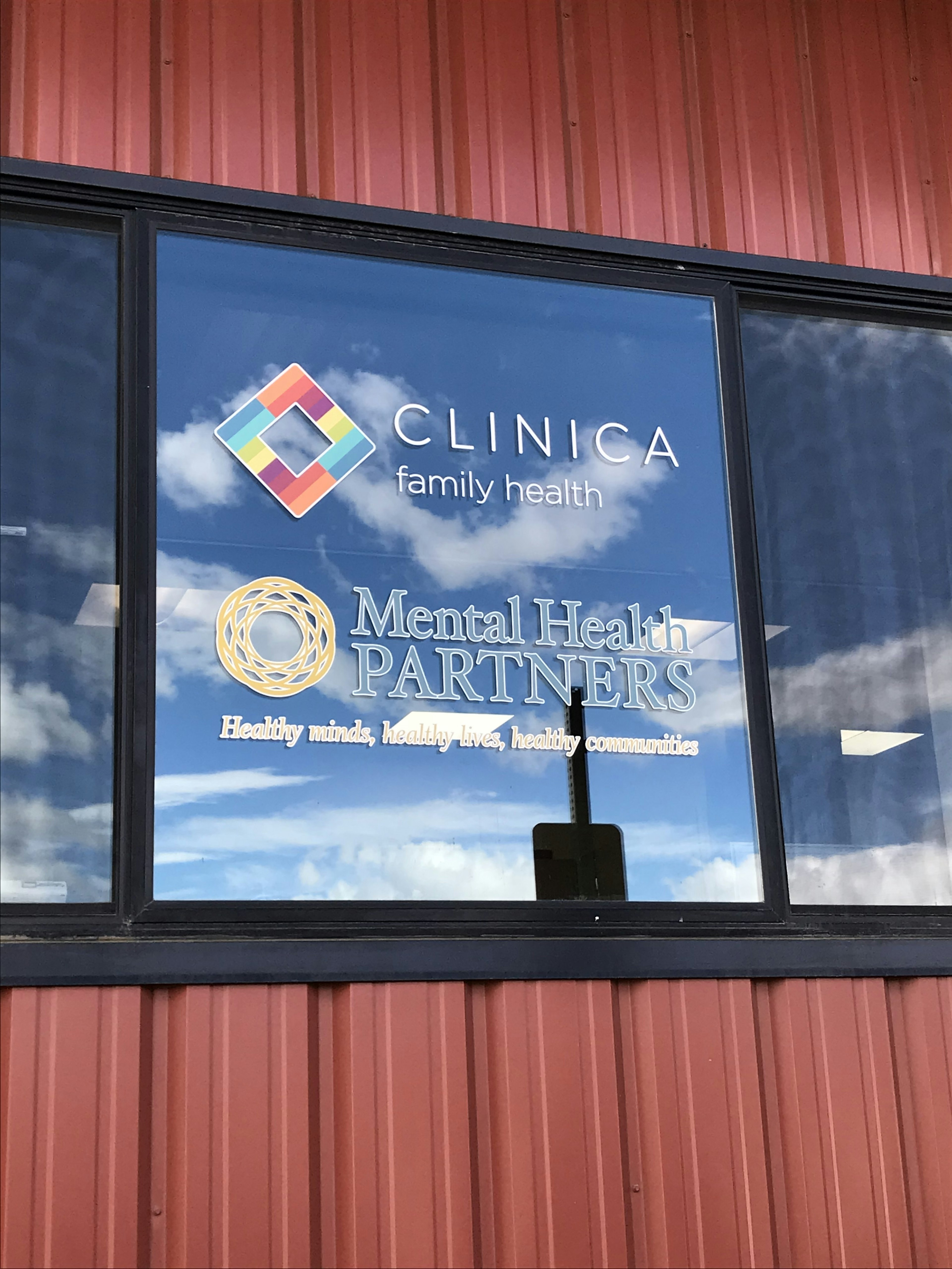 Window with Clinica and Mental Health Partners logos.